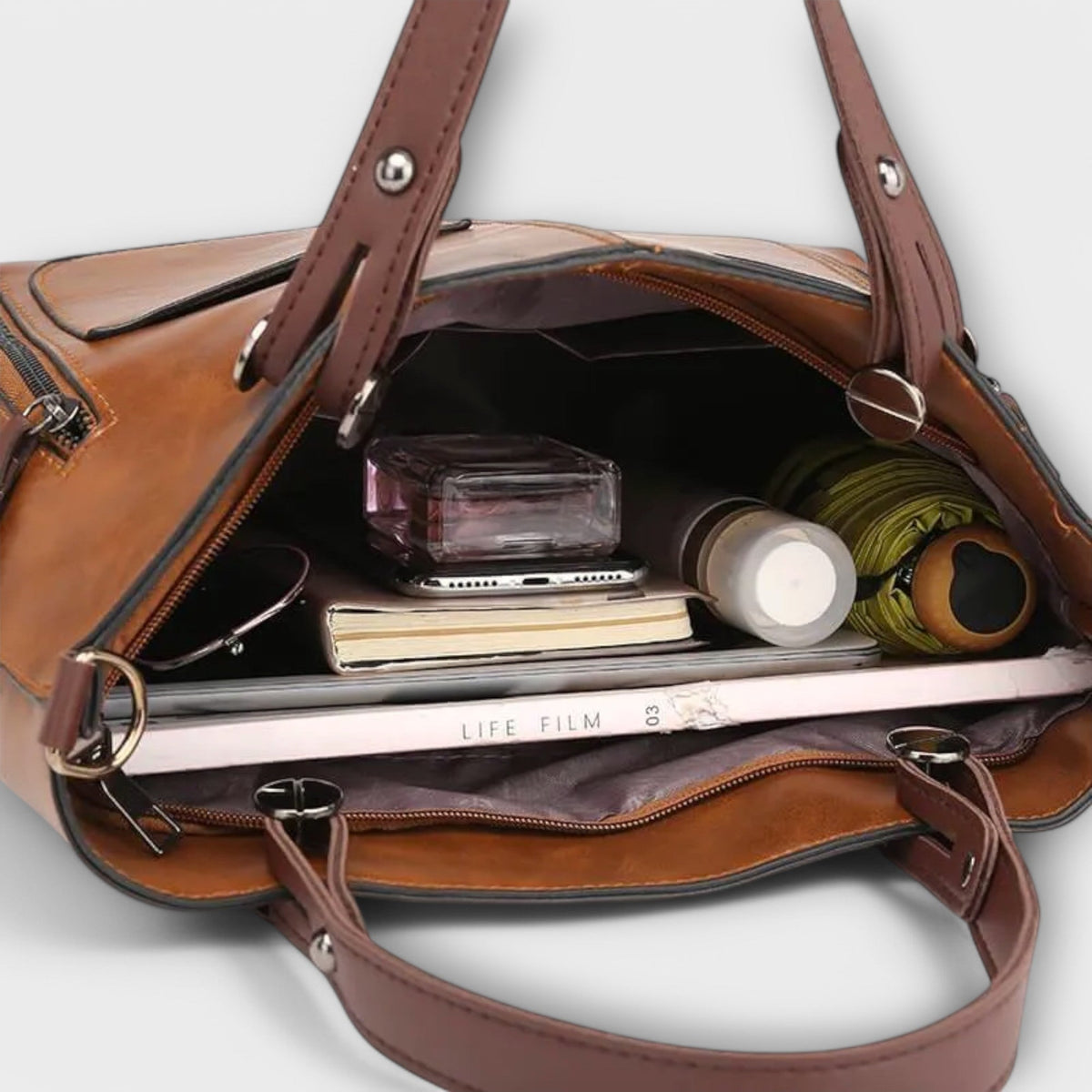 Casilda | Bolso de mano en piel con silueta depurada