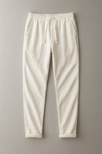 Simón, Pantalón de lino con cintura de cordón, color blanco roto, vista frontal en plano, vista principal
