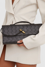 Edurne | Bolso de mano con detalle de lazo dorado