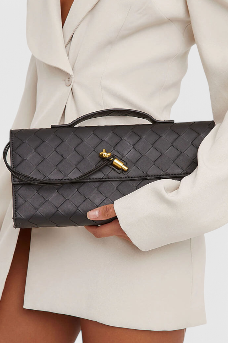 Edurne | Bolso de mano con detalle de lazo dorado