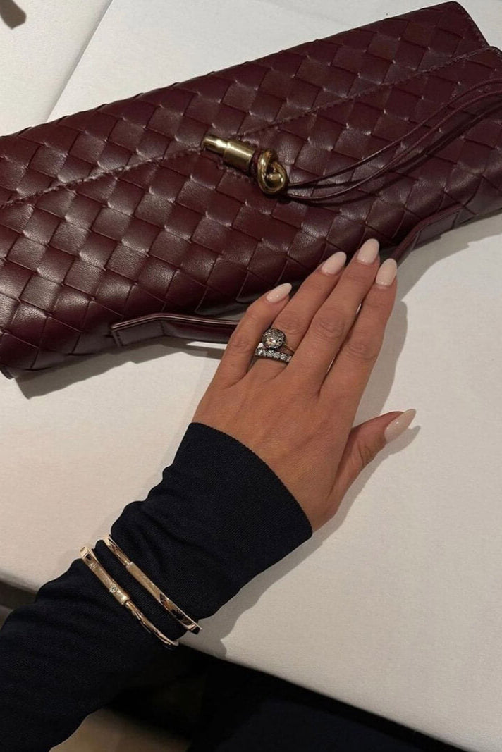 Edurne | Bolso de mano con detalle de lazo dorado